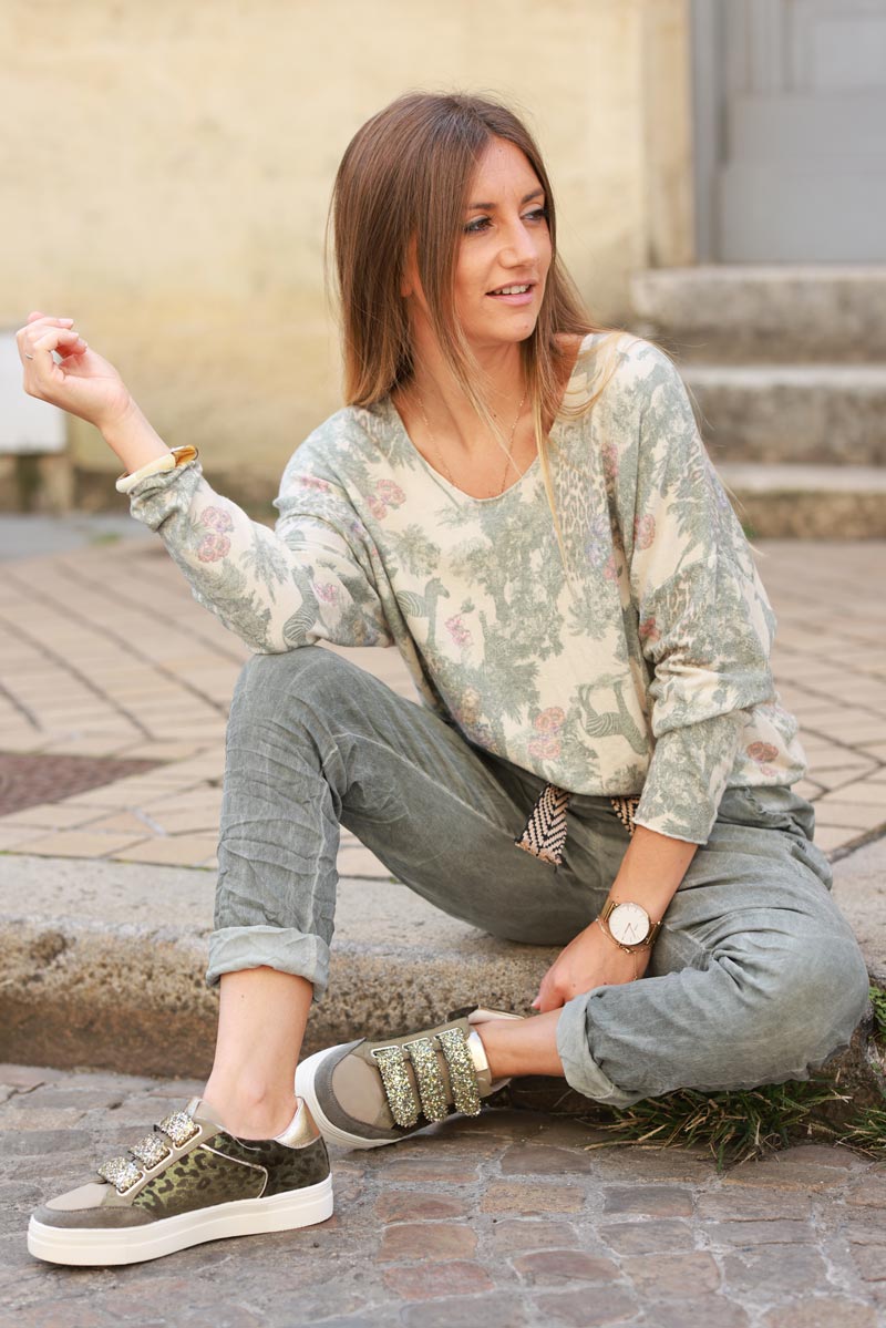 Soft olive v-neck sweater with jungle-inspired toile de Jouy print