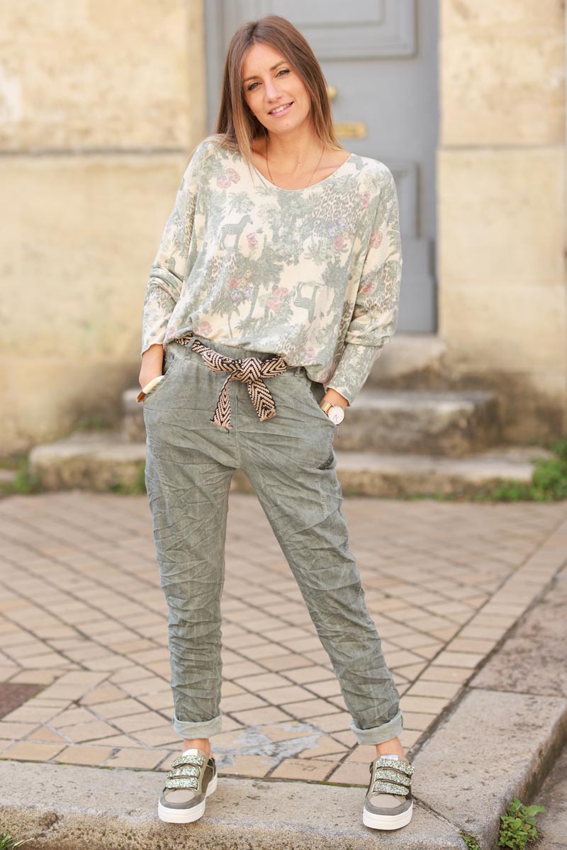 Soft olive v-neck sweater with jungle-inspired toile de Jouy print