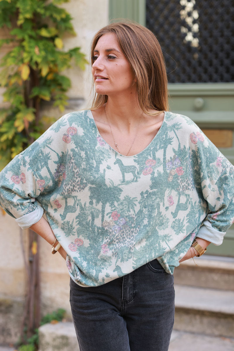 Soft Celadon green v-neck jumper with jungle-inspired toile de Jouy print