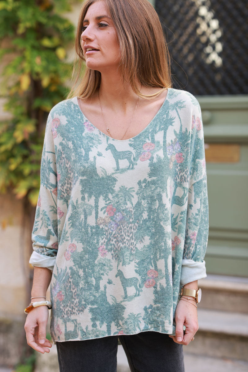 Soft Celadon green v-neck jumper with jungle-inspired toile de Jouy print