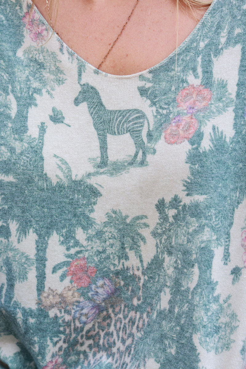 Soft Celadon green v-neck jumper with jungle-inspired toile de Jouy print