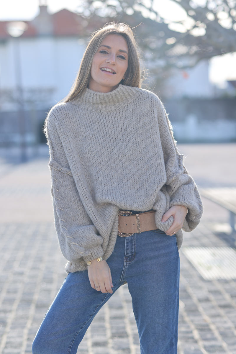 Oversized chunky knit sweater in beige with gold seam stitching detail