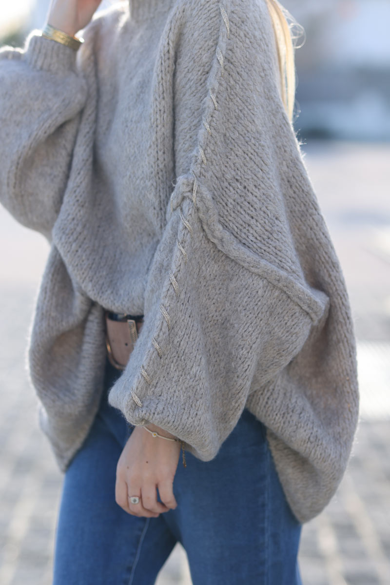 Oversized chunky knit sweater in beige with gold seam stitching detail