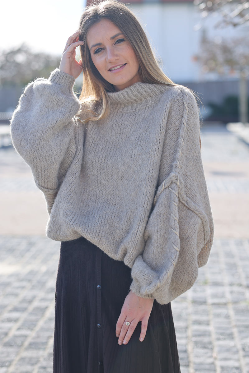 Oversized chunky knit sweater in beige with gold seam stitching detail
