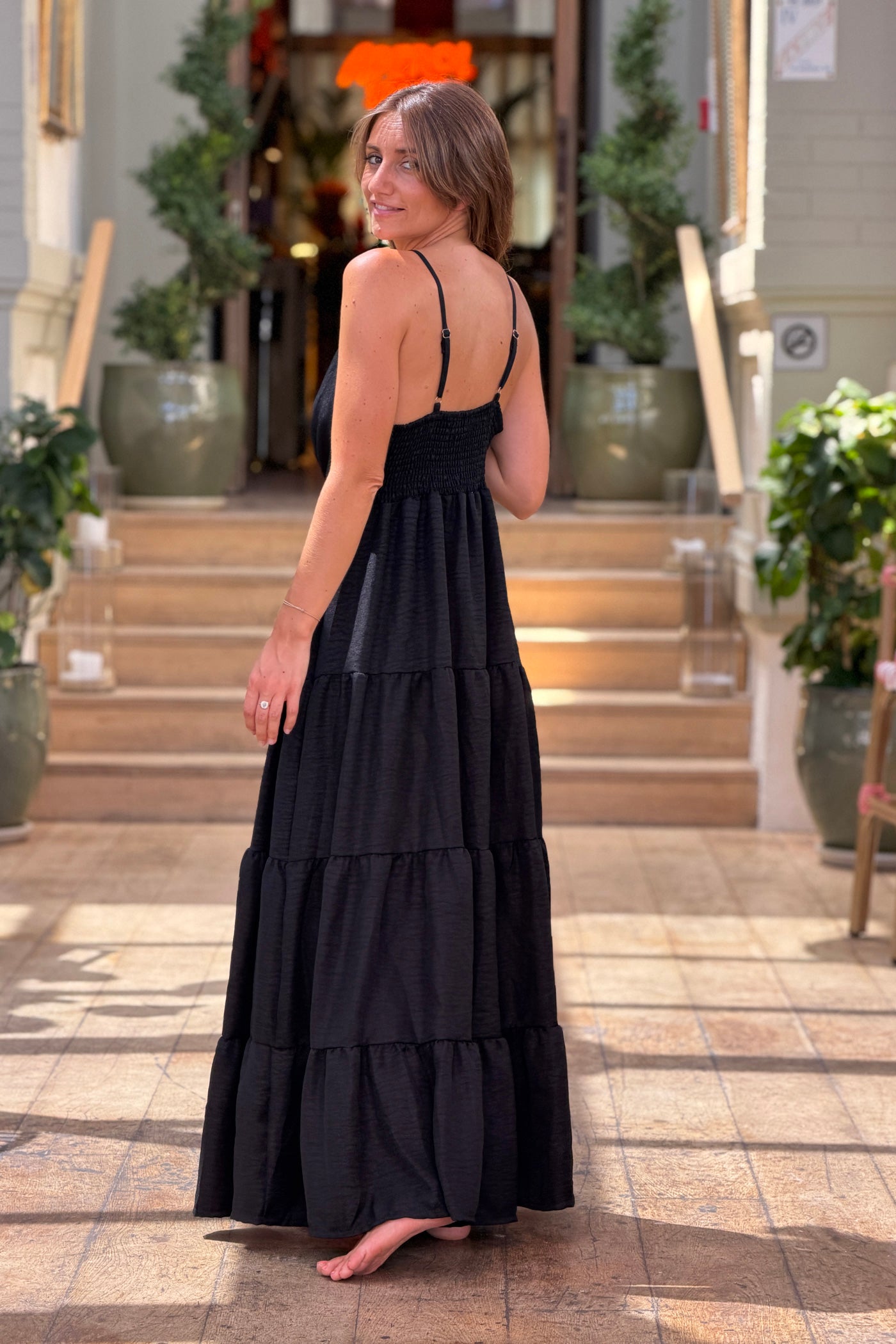 Black Tiered Goddess Maxi Dress with Golden Sun Brooch