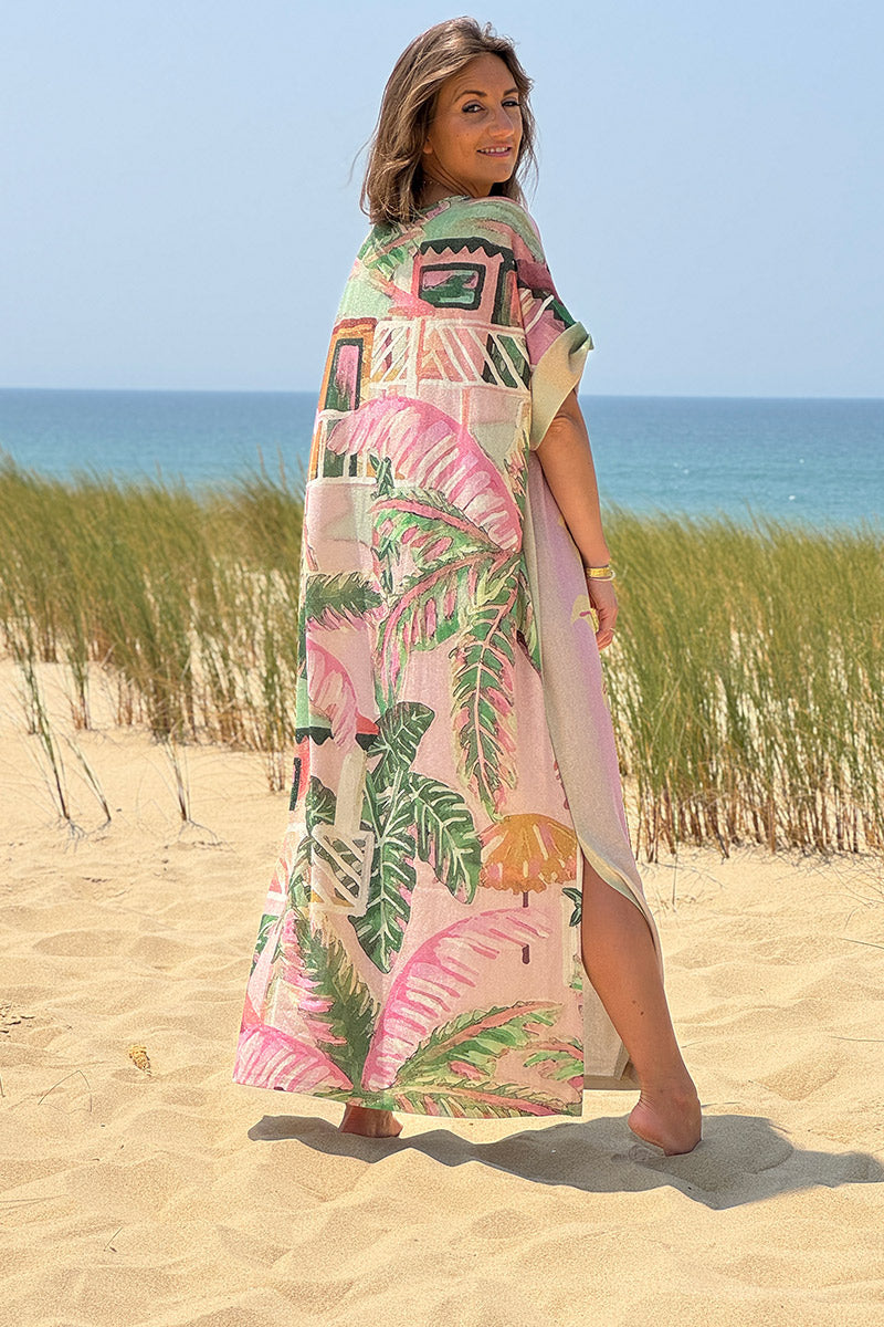 Robe longue brillante motif soleil palmiers et rayures pastel poche et col sequins