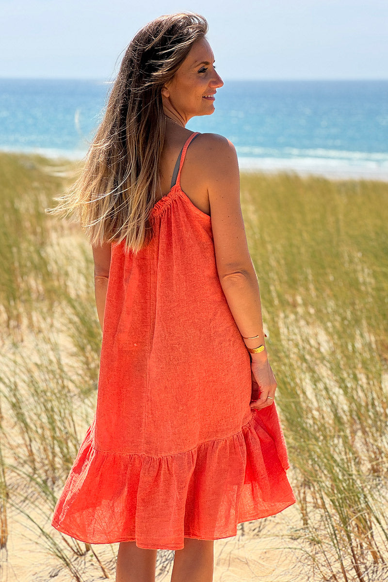 Robe orange à bretelles en coton col élastique bas volants
