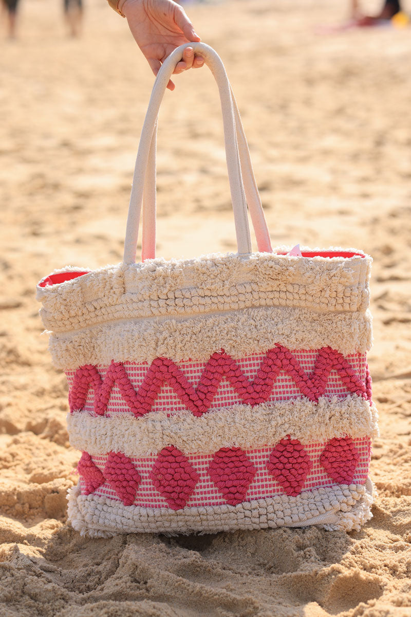 Ecru woven cotton basket with fuchsia aztec print