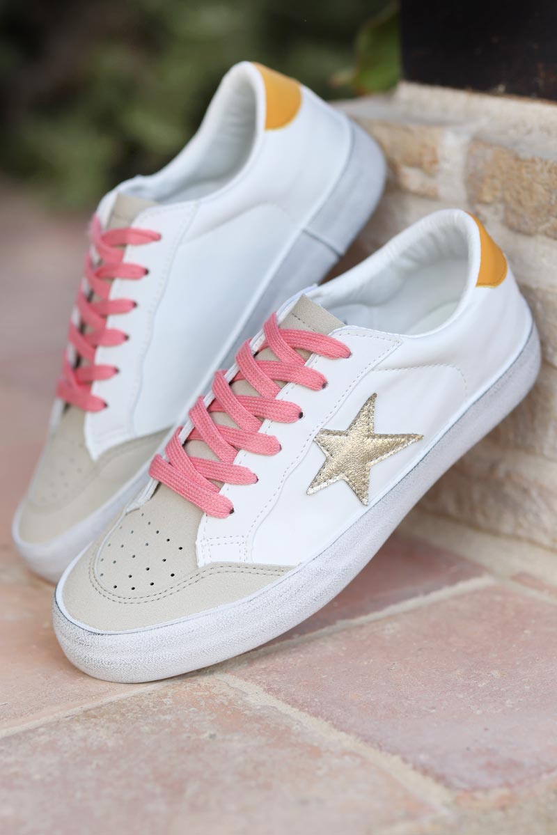 White sneakers with gold star and pink laces