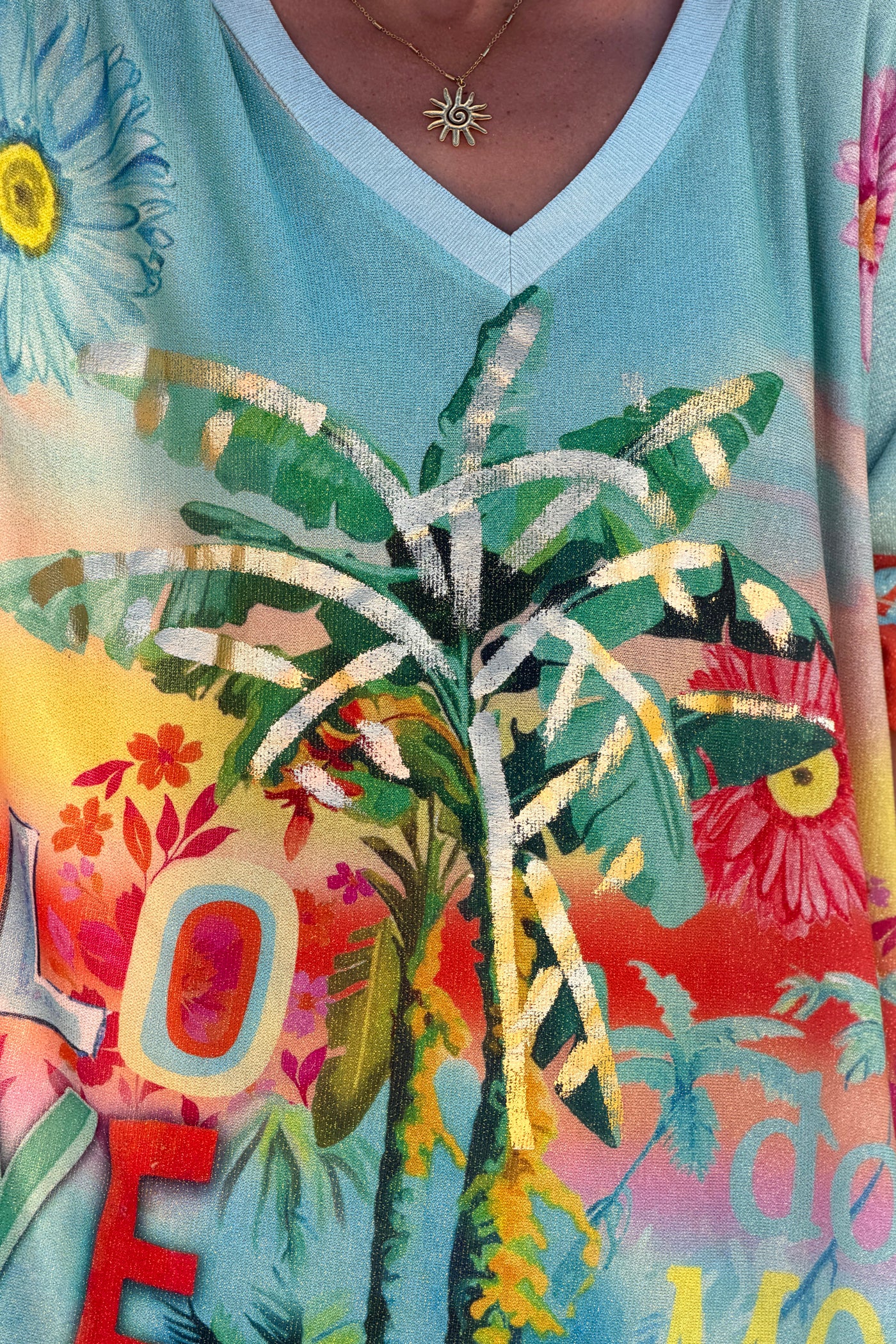 Top large turquoise brillant lurex imprimé tropical palmiers