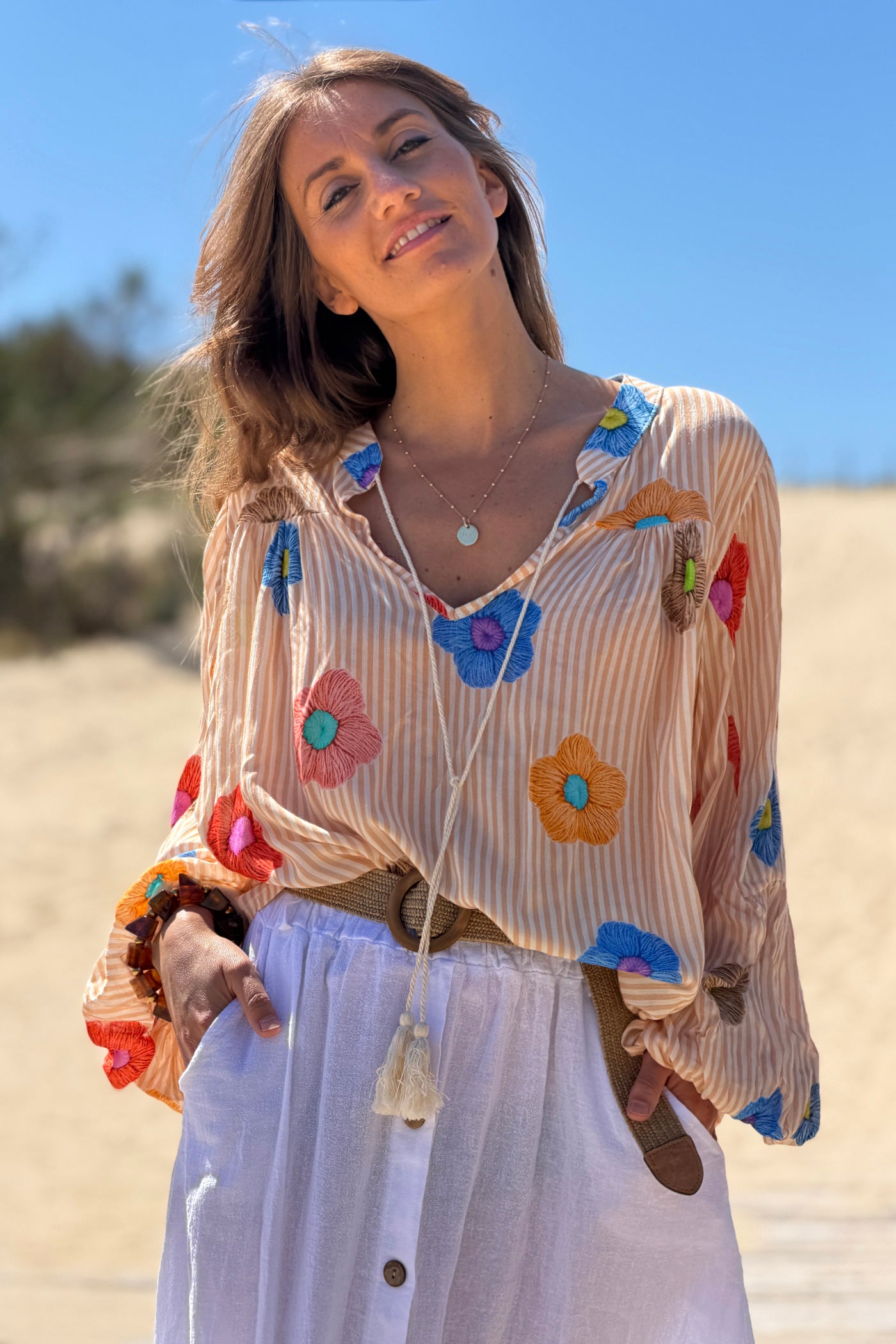 Floaty semi-sheer blouse with orange stripes and colourful flower print