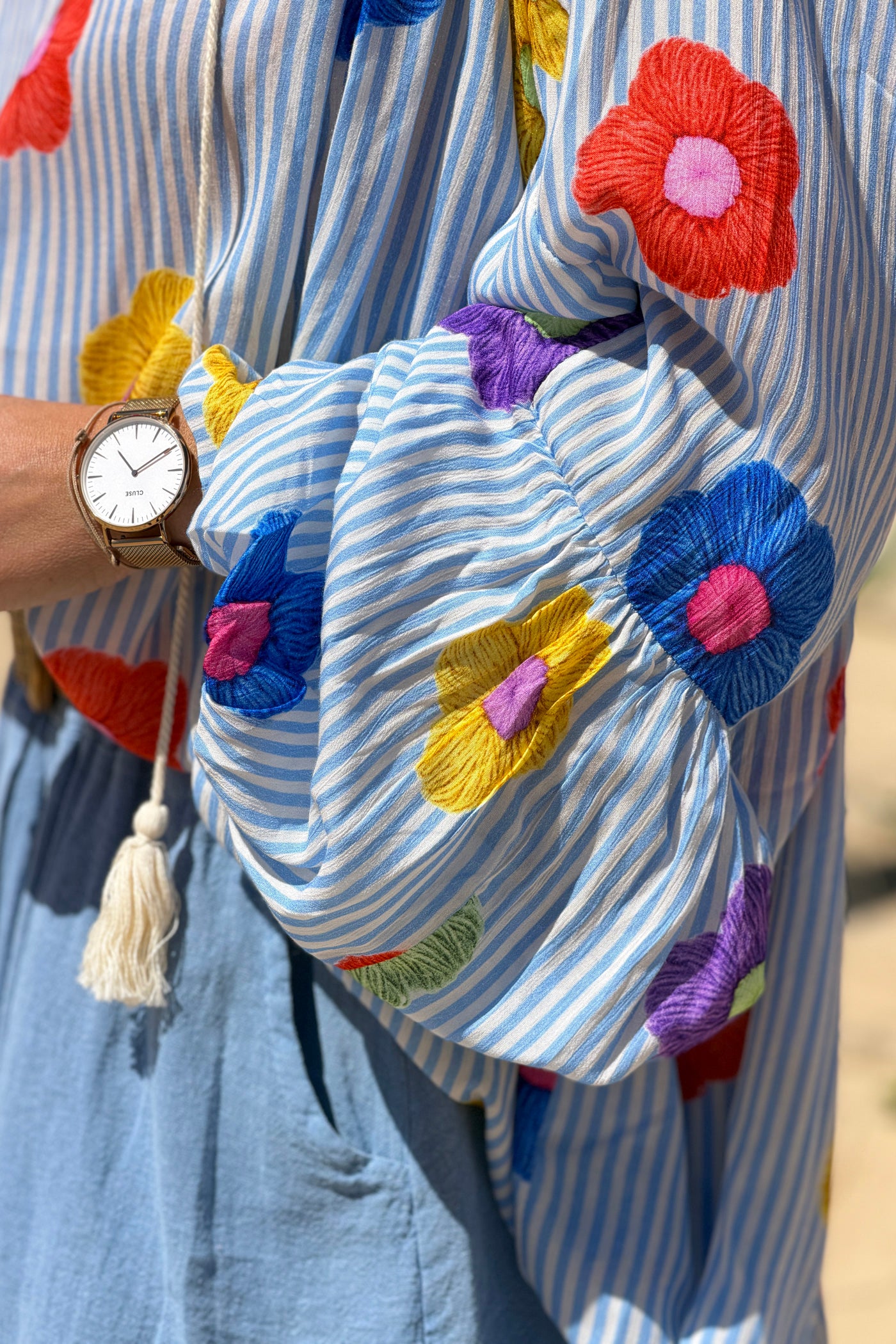 Floaty semi-sheer blouse with blue stripes and colourful flower print