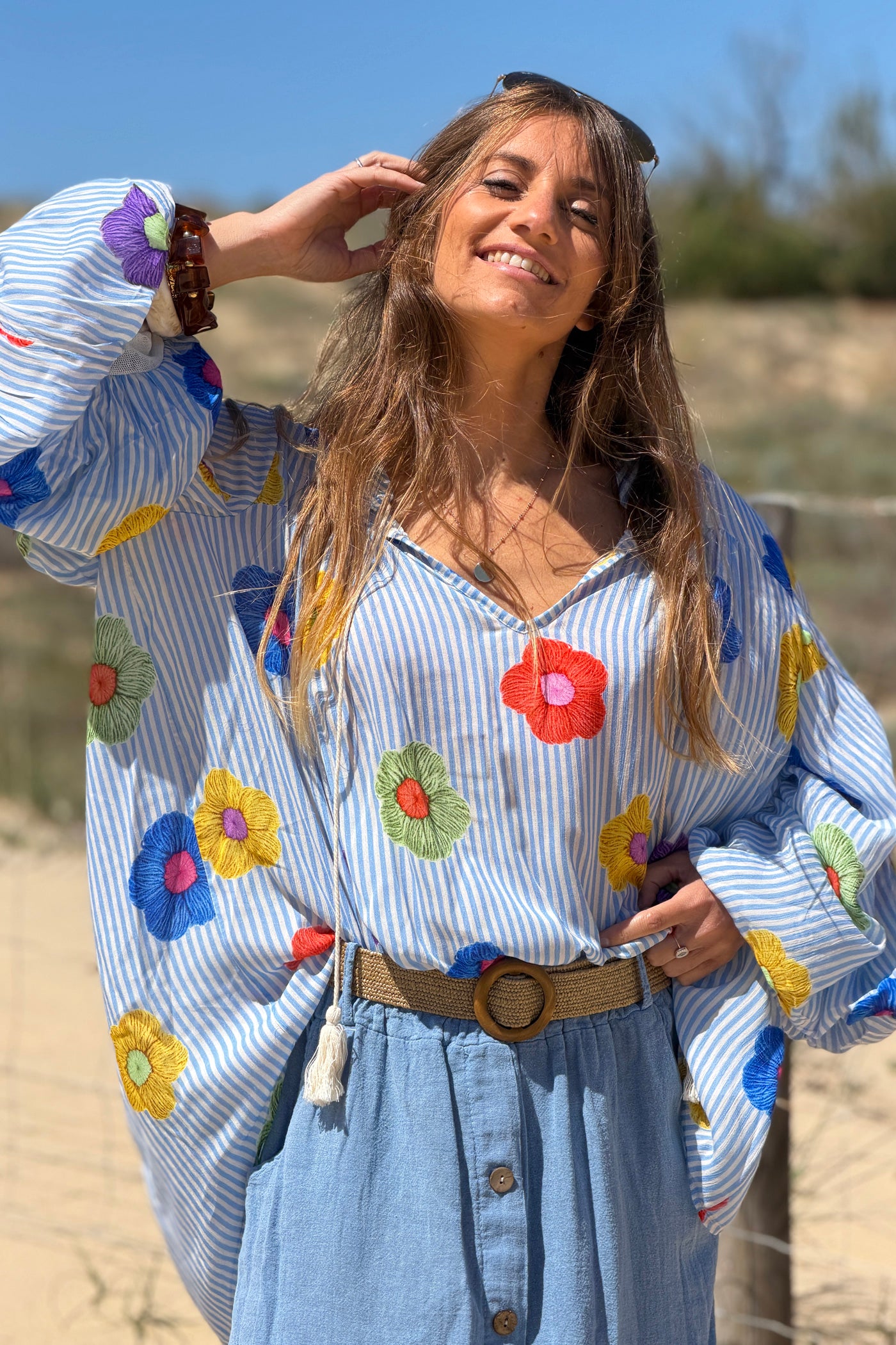 Floaty semi-sheer blouse with blue stripes and colourful flower print