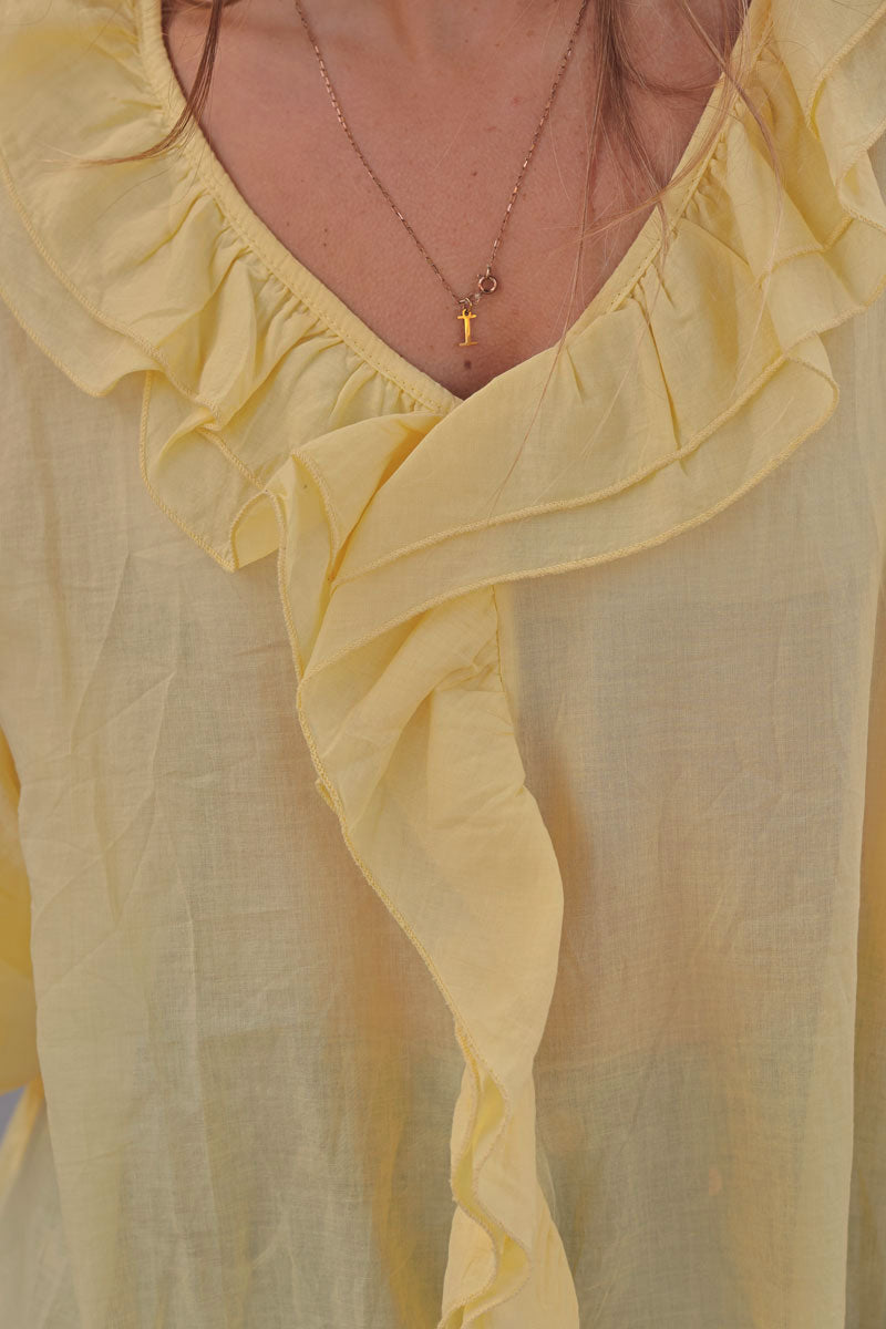Tunique large voile de coton jaune manches longues avec volant au col