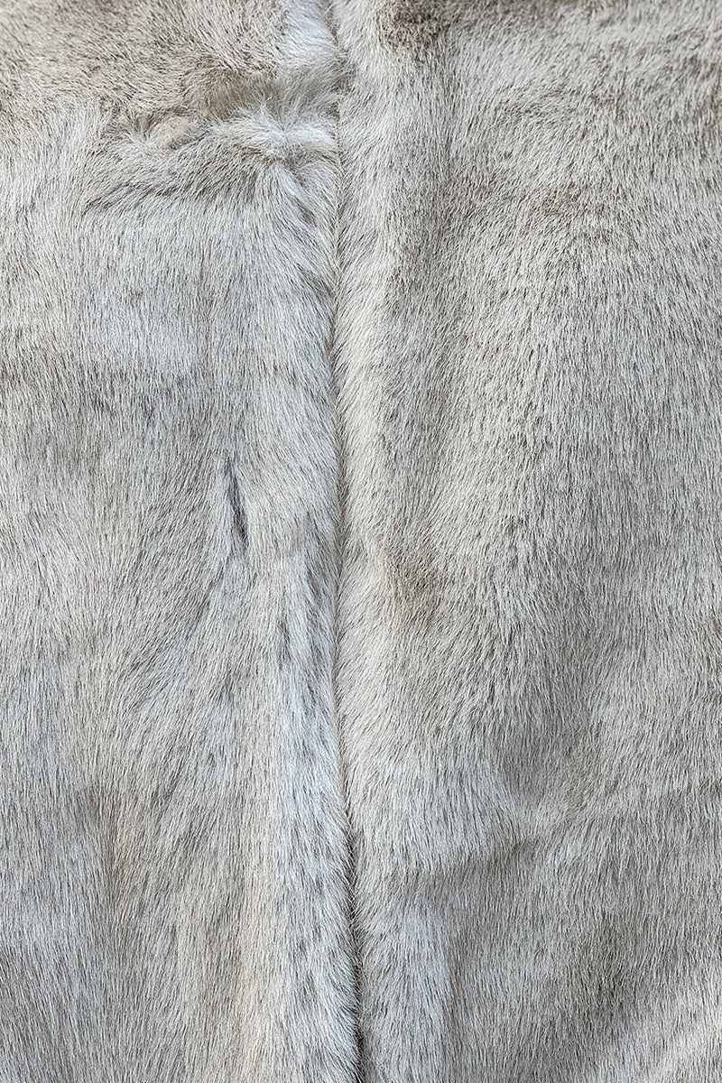 Veste sans manches fausse fourrure beige col montant et fermeture zip