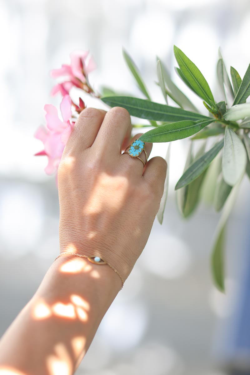 Adjustable gold ring with imitation turquoise stone and star design