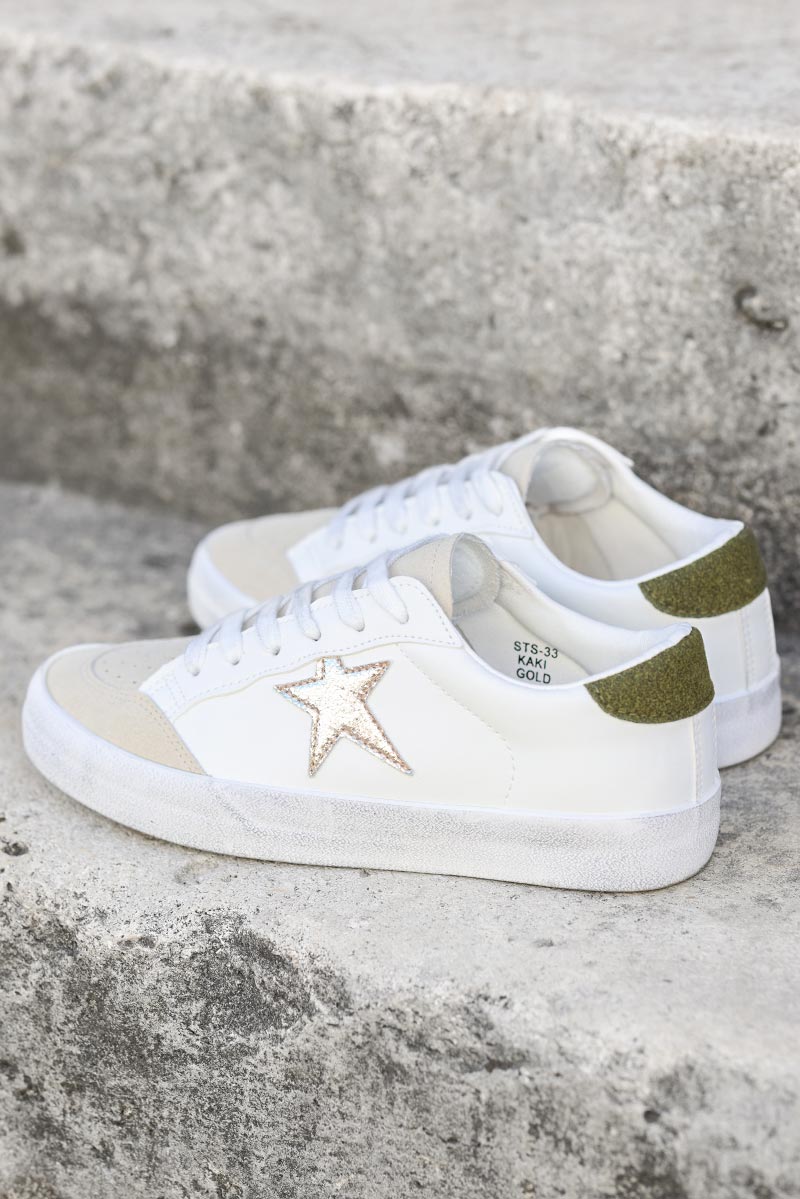 White trainers with store stars on them