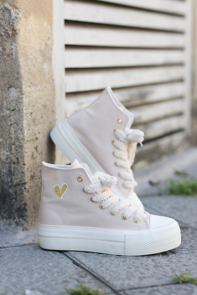 Beige flatform hi trainers with fleece laces and gold heart