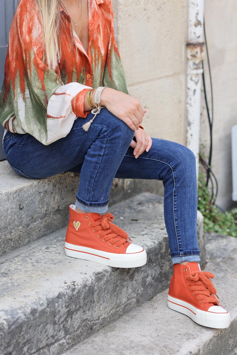 Brick red flatform hi trainers with fleece laces and gold heart