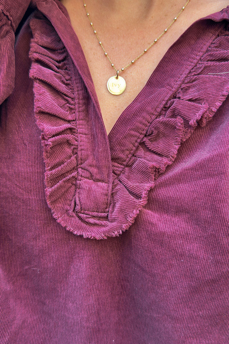 Blouse large aubergine en velours côtelé fin col v froufrou