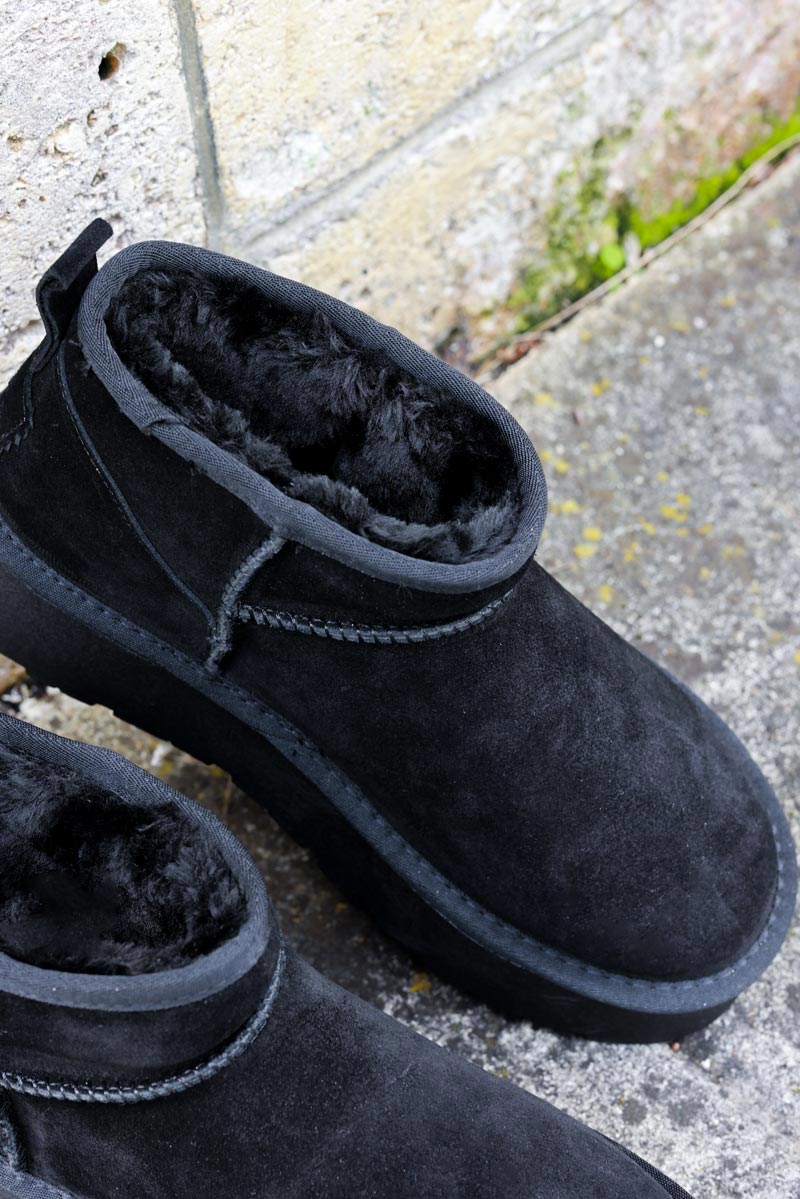 Botas bajas de piel con plataforma forradas en pelo negras