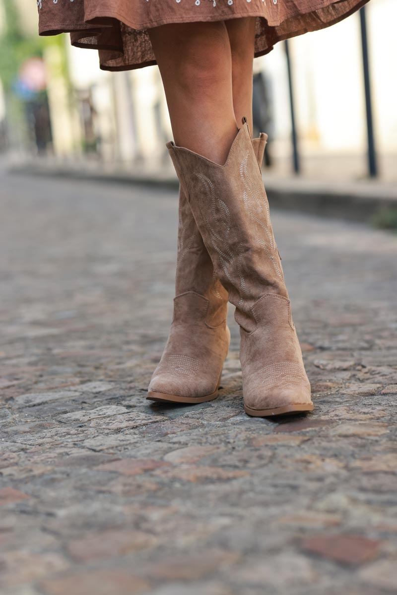 Taupe cowboy boots with embroidery, heel, and pointed toe