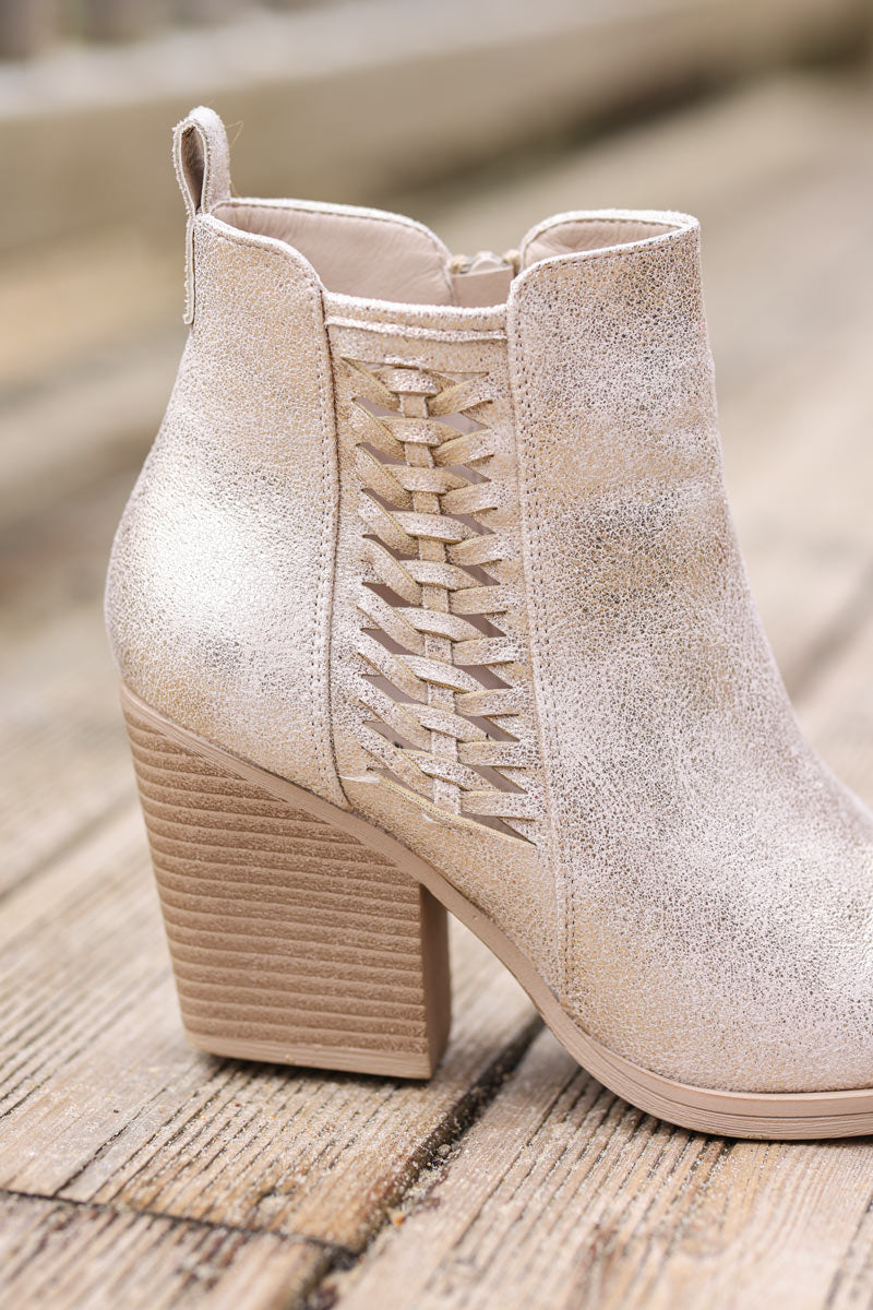Gold metallic cowboy ankle boots with woven detail