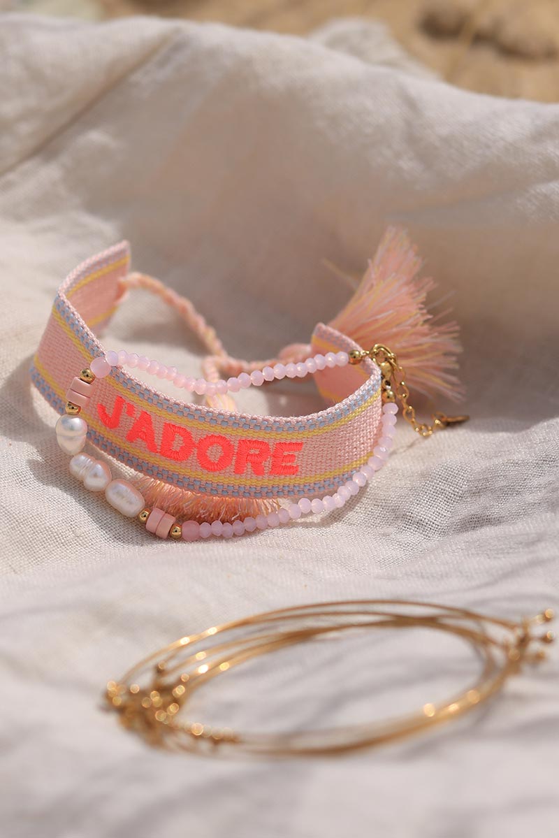 Pink fabric bracelet with neon 'J'adore' embroidery 