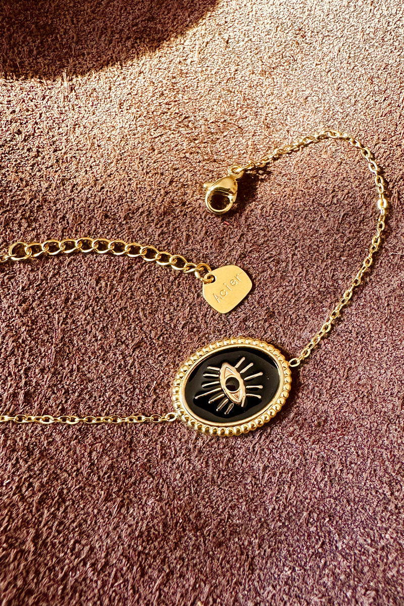 Small chain bracelet with black and gold eye pendant