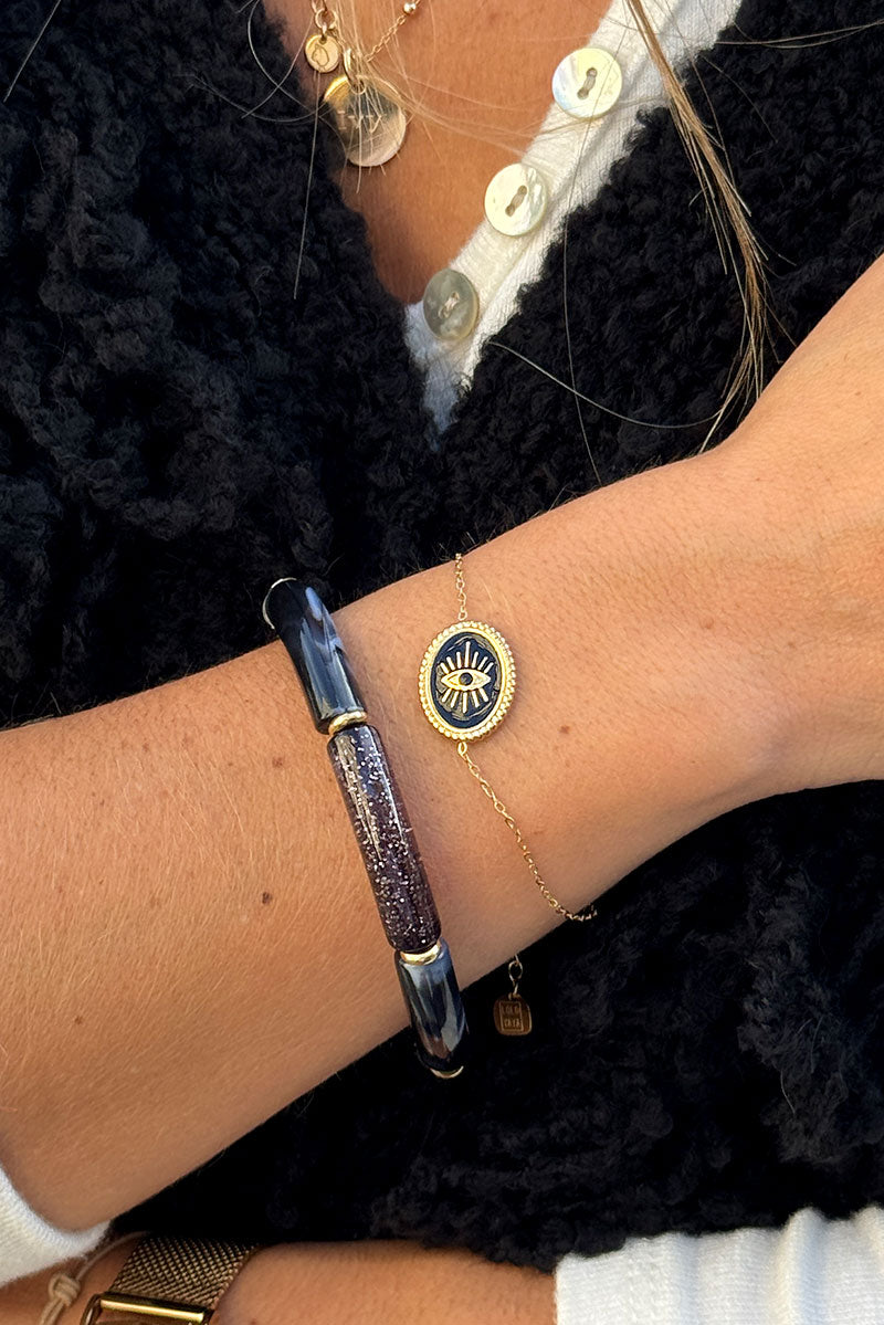 Small chain bracelet with black and gold eye pendant