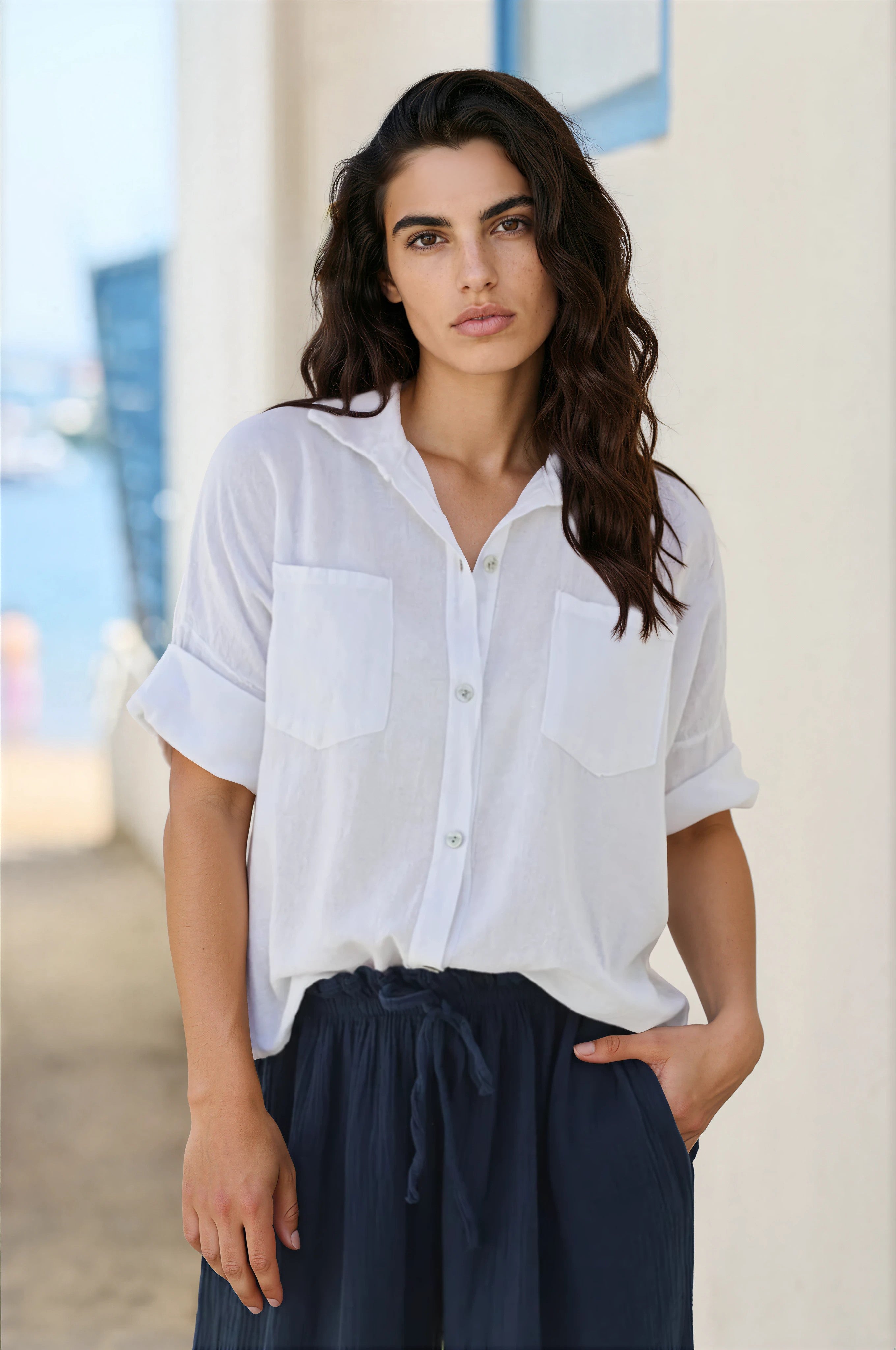 White soft cotton blouse with 3/4 sleeves and large pockets
