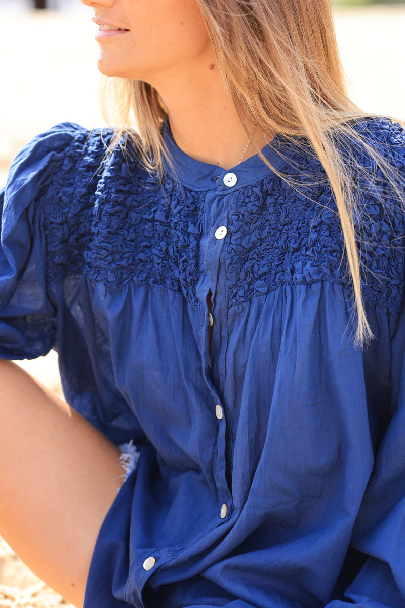 Smocked navy blue floaty blouse with mother of pearl buttons