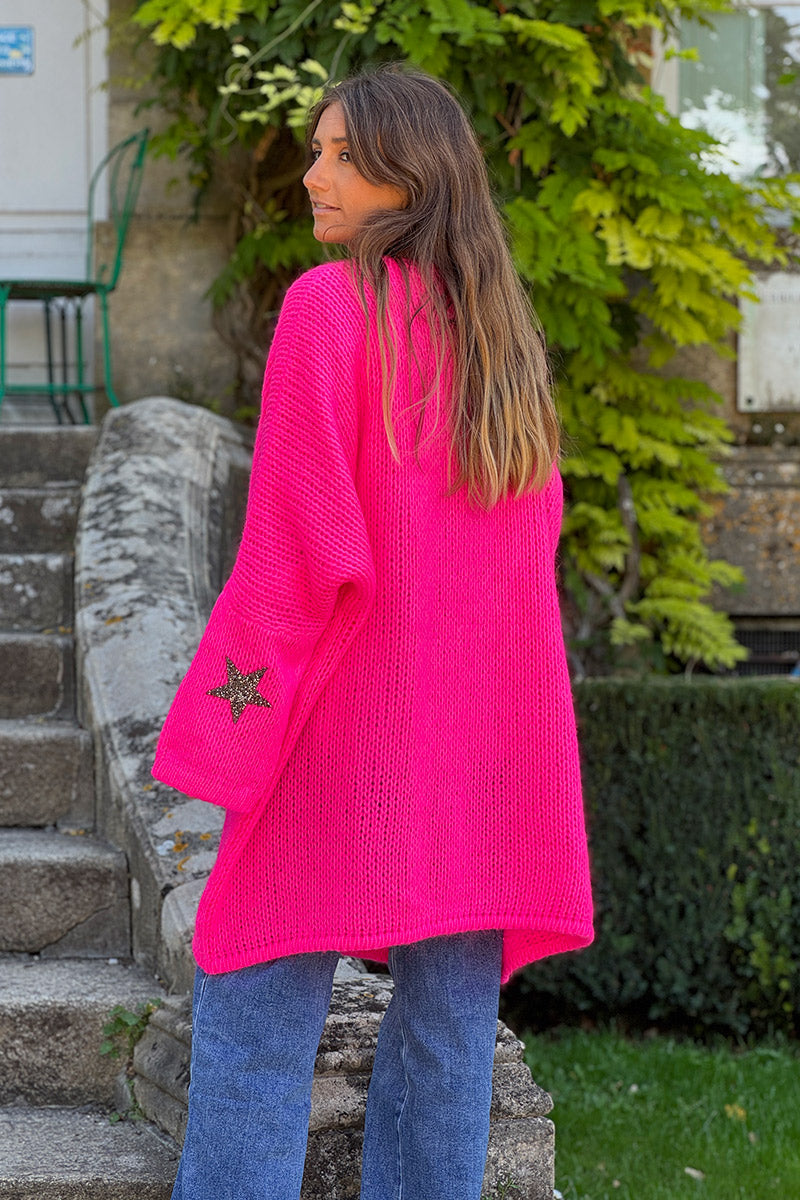 Gilet fuchsia fluo mi long grosses mailles étoile strass manches