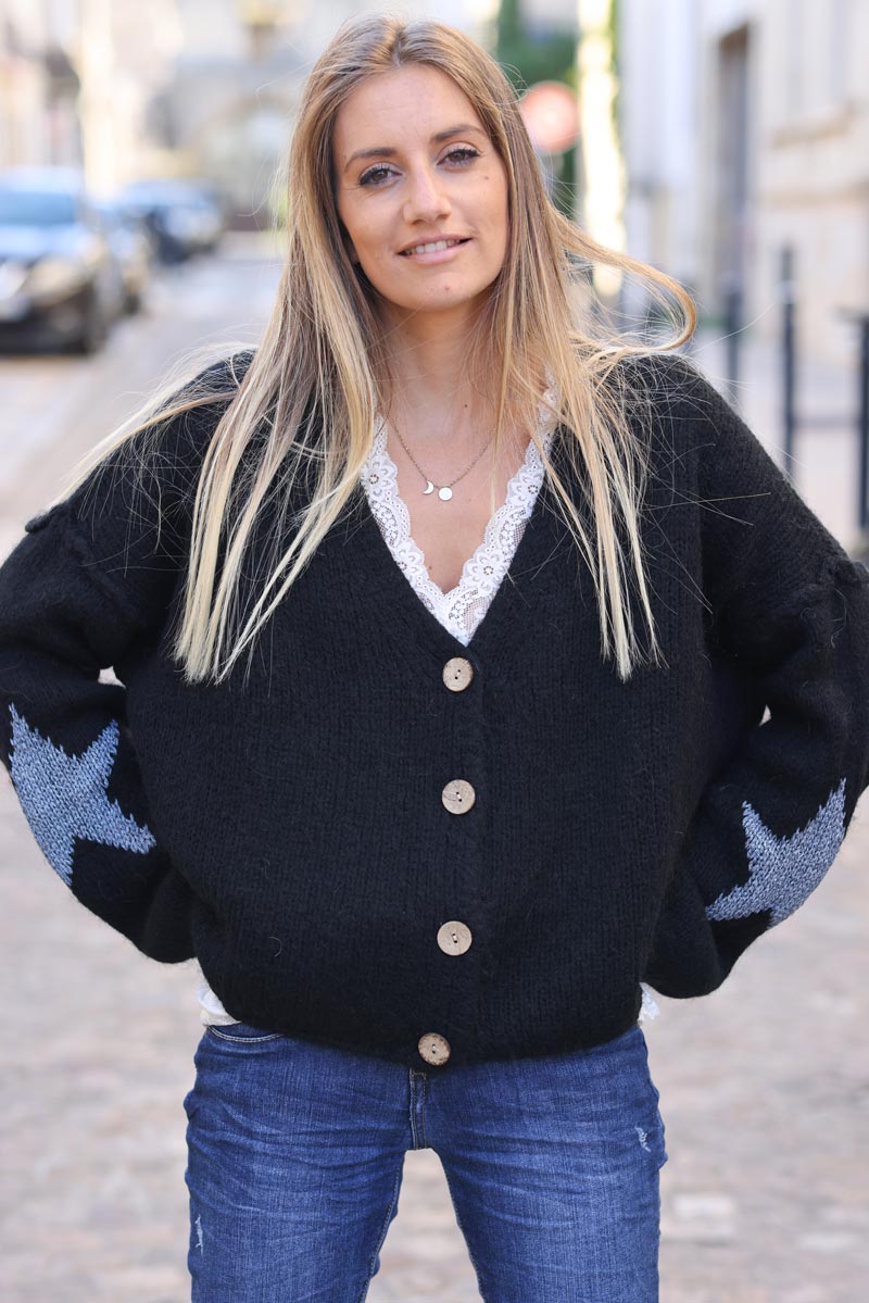 Black chunky knit cardigan with wood buttons and gold stars