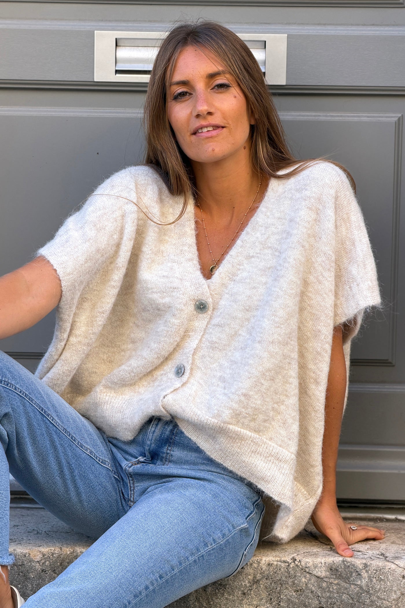 Gilet sans manches beige coupe loose en maille chinée boutons nacrés