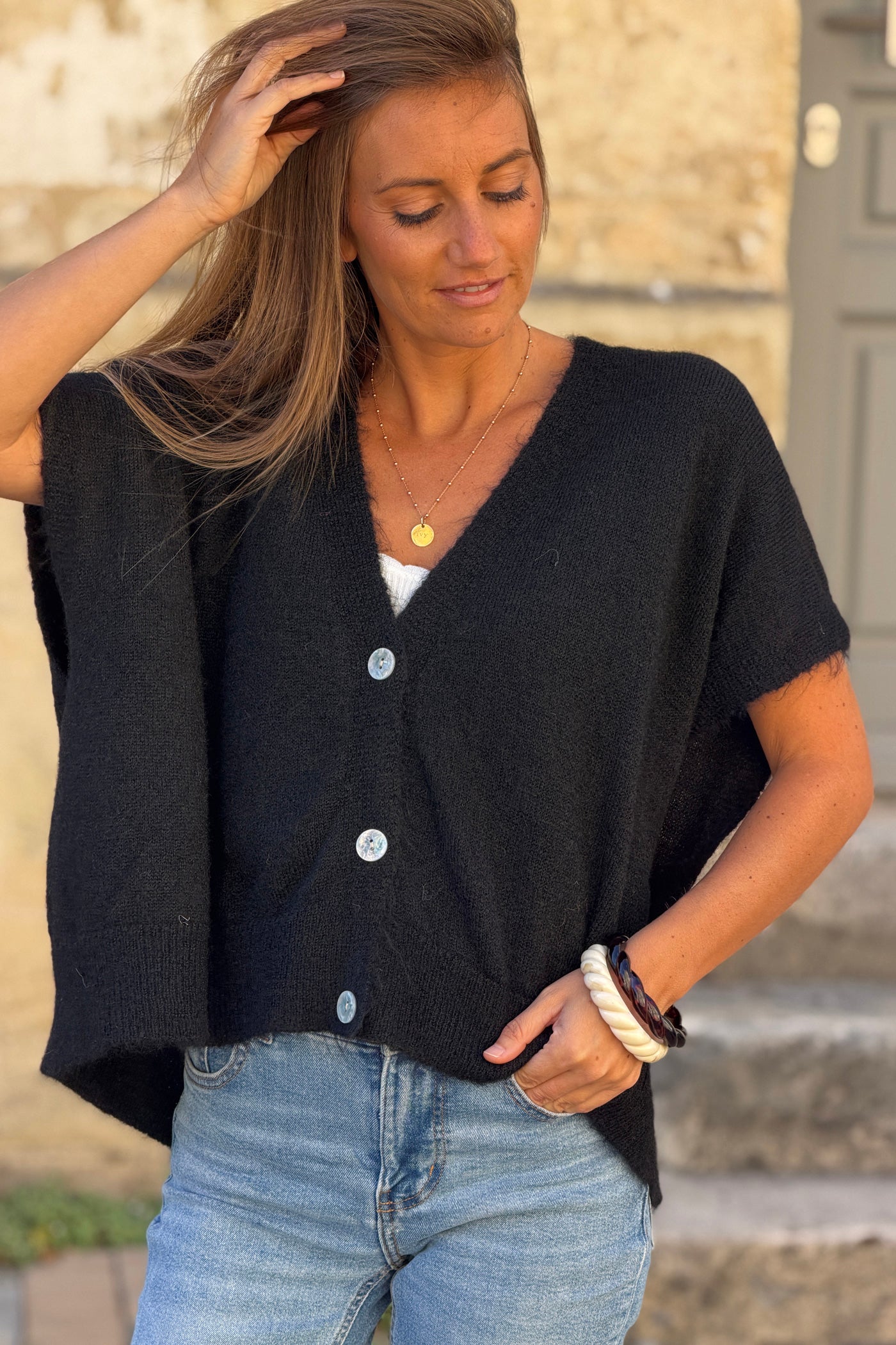 Gilet sans manches noir coupe loose en maille chinée boutons nacrés