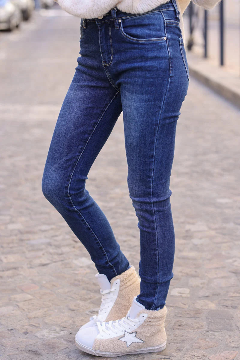 Dark wash denim jeans slim cut with frayed hems