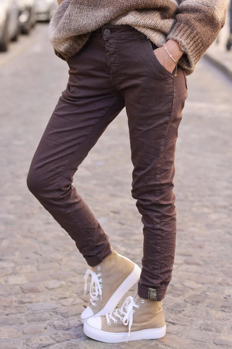Slim fit chocolate jeans with silver ankle hem edging