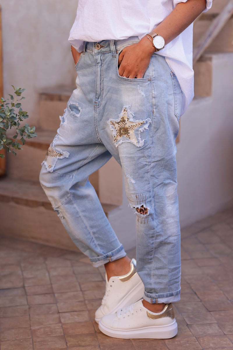 Light washed stretch jeans with sequin eye and leopard inserts
