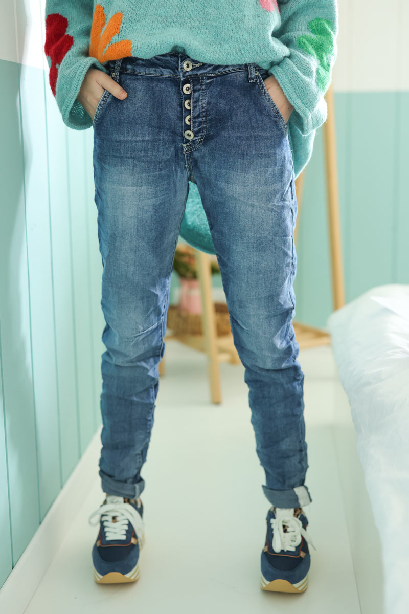 Washed blue skinny jeans with silver hem detail