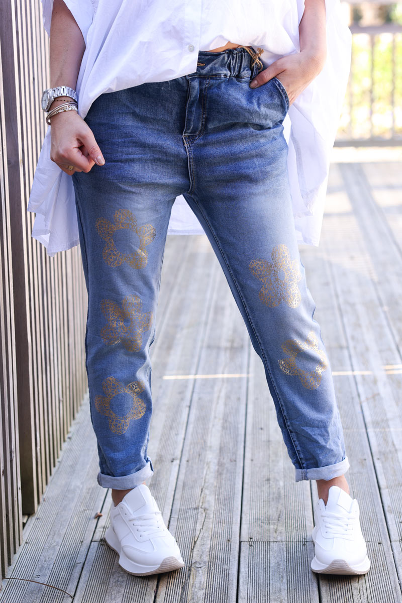 Mid-washed comfort stretch jeans with gold metallic flower print