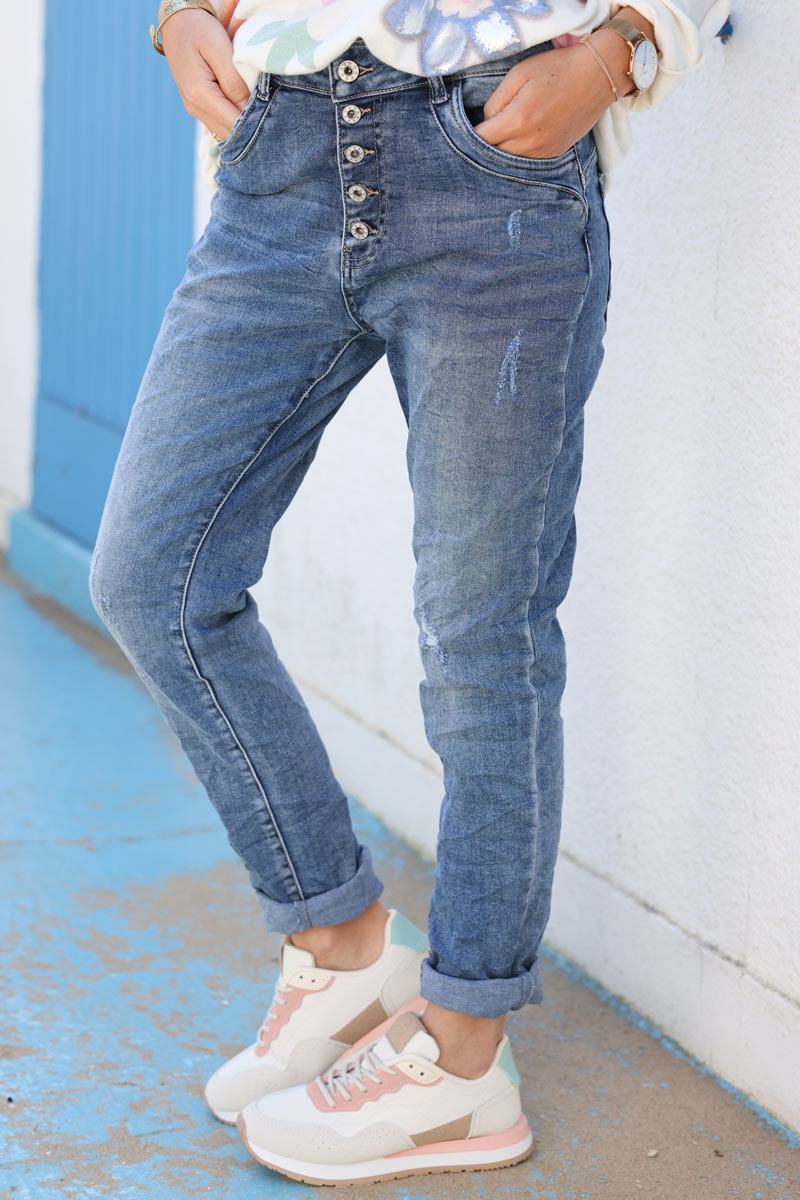 Mid washed lightly distressed slim stretch jeans