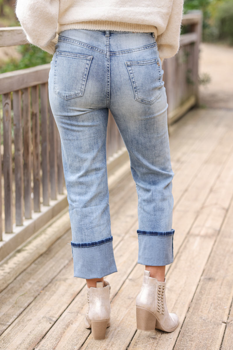 Washed denim blue jeans with a wide leg cut