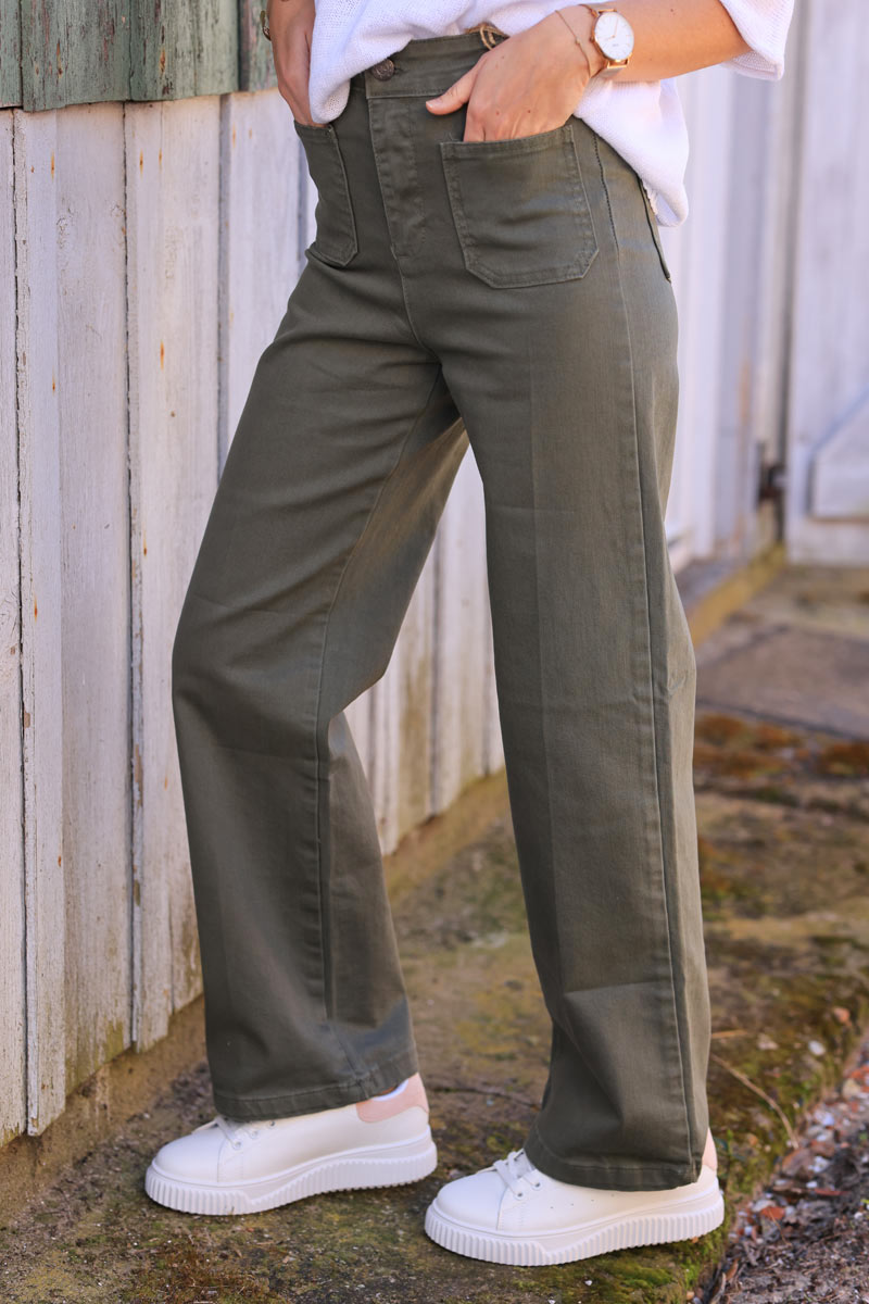Khaki bootcut jeans with a wide leg cut and patch pockets