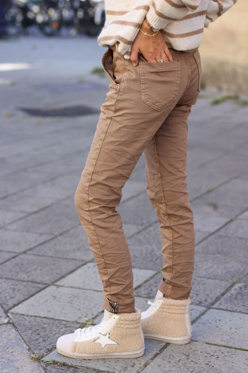 Slim fit ice brown jeans with silver ankle hem edging