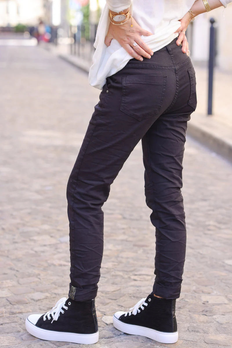Slim fit black jeans with silver ankle hem edging