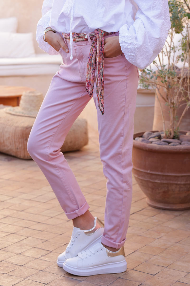 Pink stretch slim fit jeans with motif scarf belt