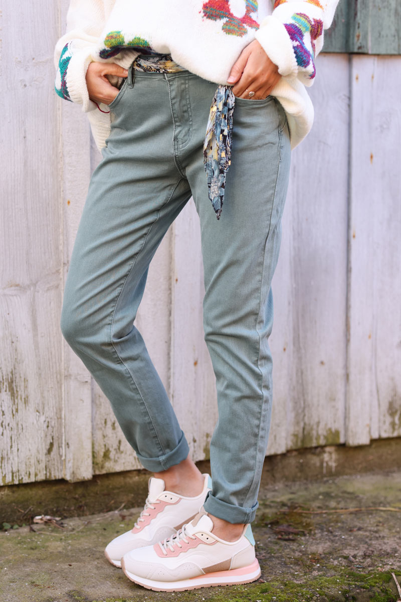 Celadon green stretch slim fit jeans with motif scarf belt
