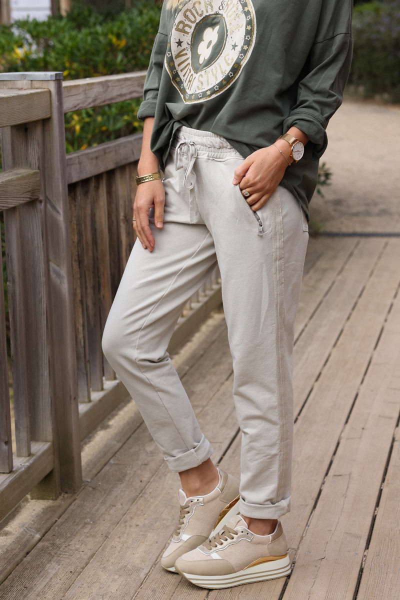 Beige stretch sweatpants with ribbon outseam zipped pockets