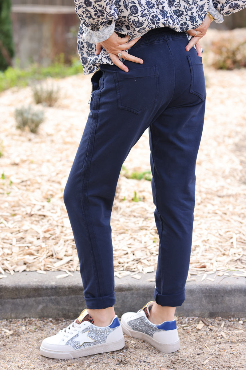 Navy blue stretch sweatpants with ribbon outseam zipped pockets